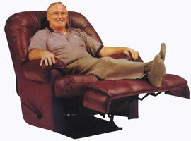 Man sitting in large armchairs